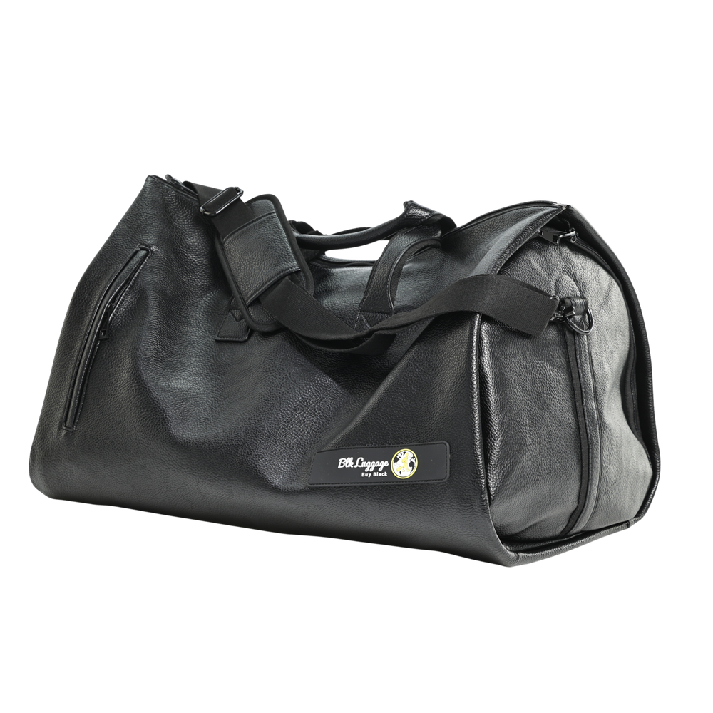 The Weekend black garment duffel with carry handles and shoulder strap.