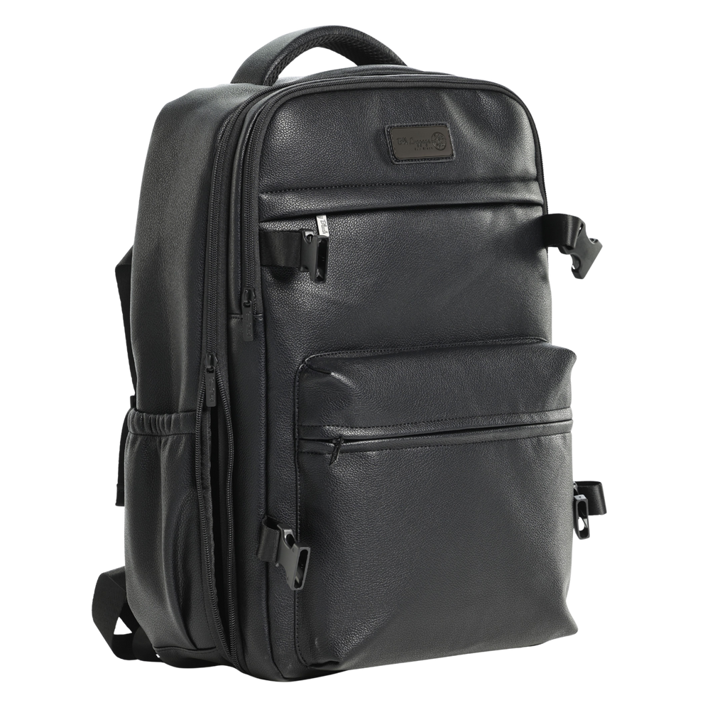 The Overnight black travel backpack with front zippered pockets.