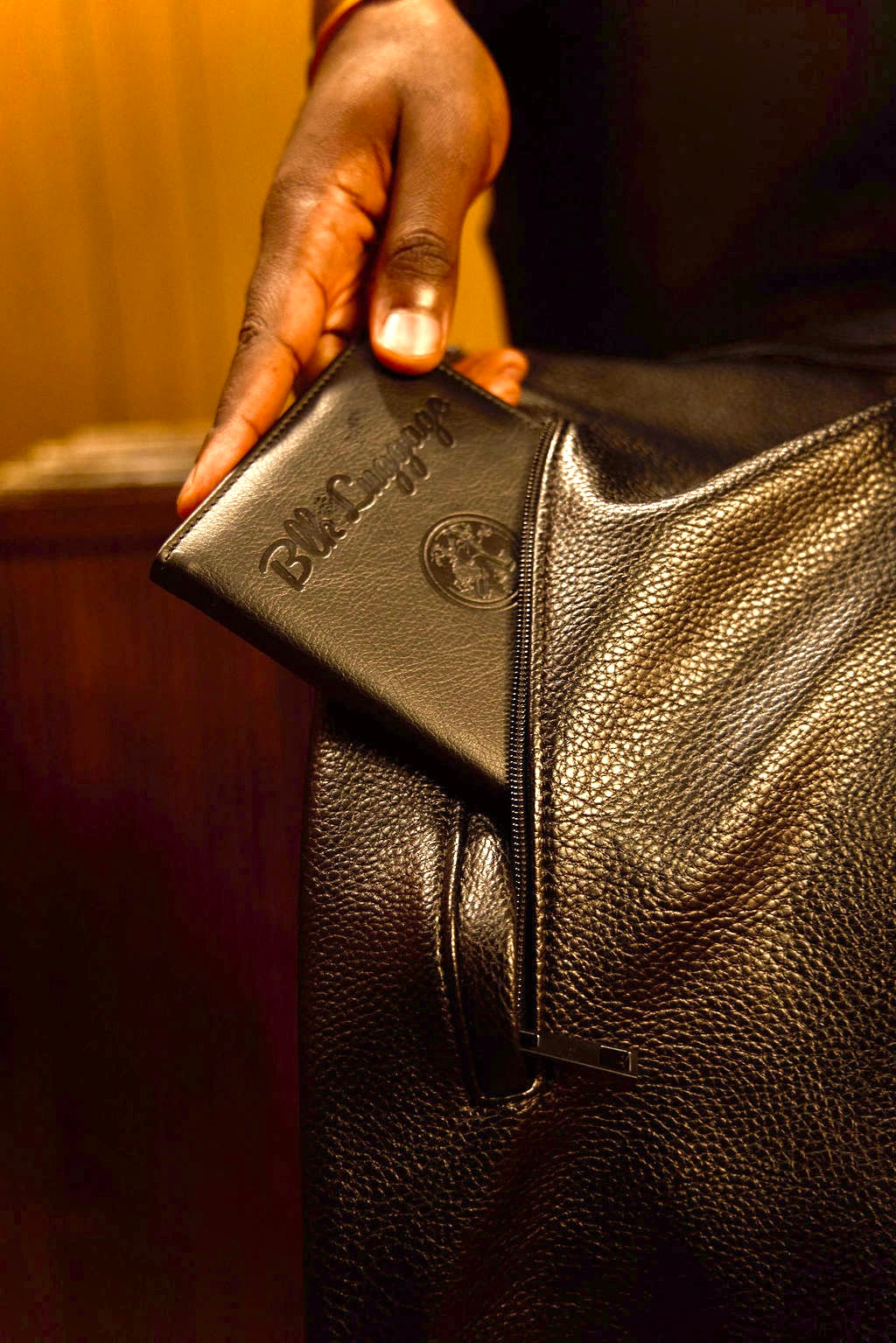 BLK Luggage vegan leather passport holder and weekender bag — close-up detail